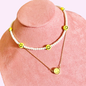 Collar carita feliz perlas.